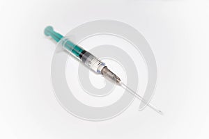 Syringe with needle on white background