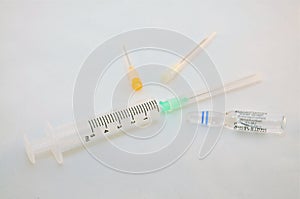 Syringe with needles and a vial