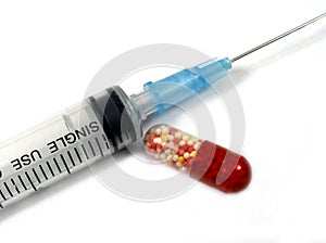 Syringe and pills