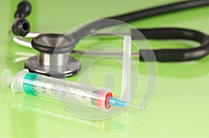 Syringe and stethoscope