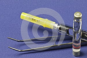 Syringe with Tweezers