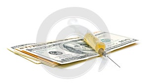 Syringe and the U.S. currency (dollars) on a white background