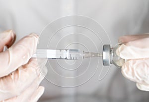 Syringe and vaccine in the hands