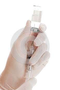 Syringe and vial in hands photo