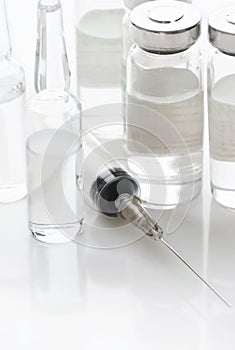 Syringe and vials with a medicine