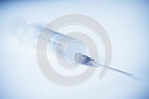 Syringe on white