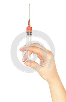 Syringe in the woman's hand for making injections