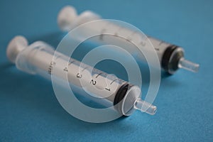 Syringes on blue paper, for people injection