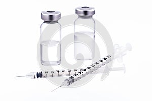 Syringes and bottles kits isolated on white