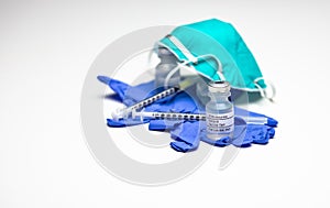 Syringes and Covid-19 Test Vaccine on Gloves photo