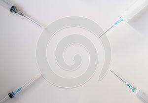 syringes with different volumes on a white background