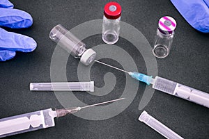 Syringes, gloves and empty vaccine vials