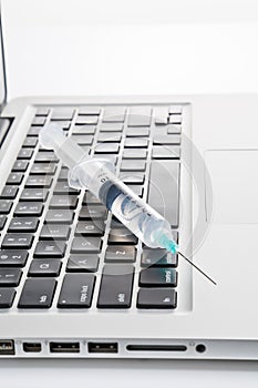 Syringes on a laptop