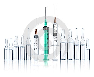 Syringes with needles and medical ampoules