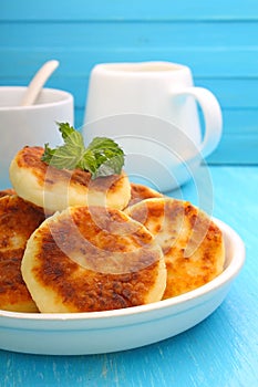 Syrniki (Cottage cheese pancakes, Fritters of cottage cheese)