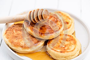 Syrniki, cottage cheese pancakes with honey