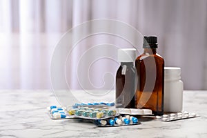 Syrup and different cough remedies on table