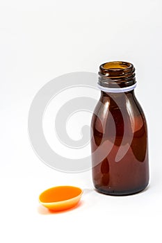 Syrup Medication Bottles and syrub in teaspoons