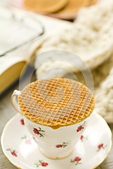 Syrup waffle on teacup vertical