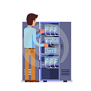 Sysadmin man working with server rack switchboard photo
