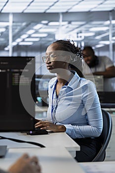 System administrator in data center optimizing IT infrastructure