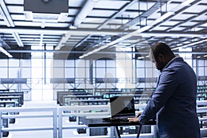 System administrator programming in AI data center