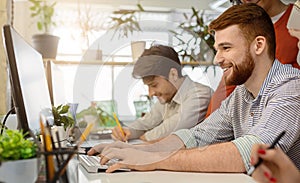 System administrator working on computer in office