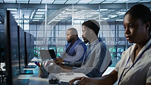 System administrators in data center implementing AI predictive systems