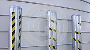 system of anti-intrusion pylons on a metal background