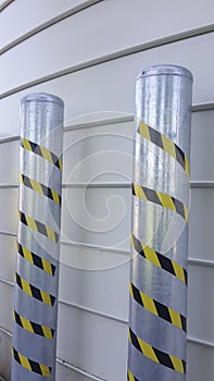 system of anti-intrusion pylons on a metal background