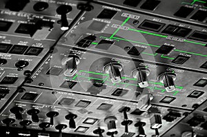 System controls, switches and buttons in the cockpit of a modern commercial airplane