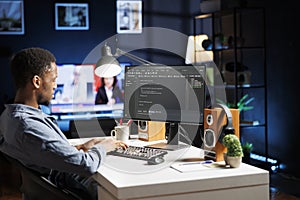 System engineer typing in script code for security and protection