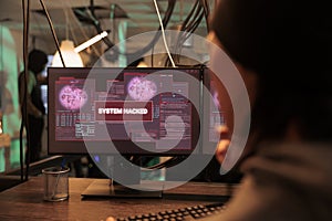 System hacked warning on screen, computer database access