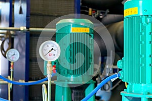 System of hot water pipes with manometer in boiler room