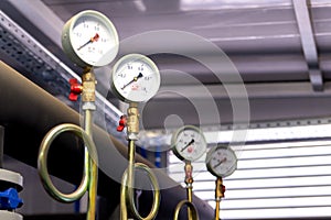 System of hot water pipes with manometer in boiler room