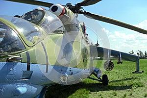SYZRAN, RUSSIA - SEPTEMBER 13, 2014: Russian military transport helicopter mi 24 at the airport with green grass front view