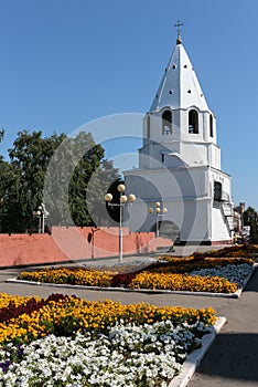 Syzran. View on the Kremlin. Flower beds in the Park behind the