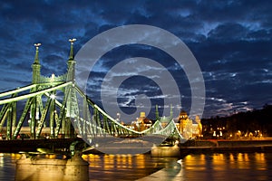 Liberty Bridge in Budapest Hungary at night with a nice cloudy s photo