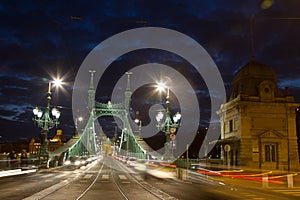 Liberty Bridge in Budapest Hungary at night with a nice cloudy s photo