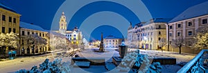 Szechenyi square at snowy night in winter in Pecs, Hungary