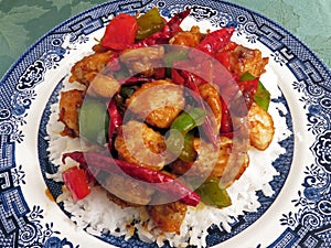 Szechuan Chicken Stir Fry Served Over White Rice For Dinner
