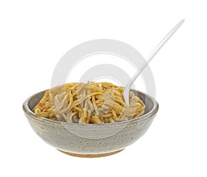 Szechuan noodles in old bowl with fork