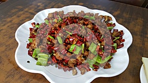 Szechuan style fried diced chicken with dried red chili and green chili peppers