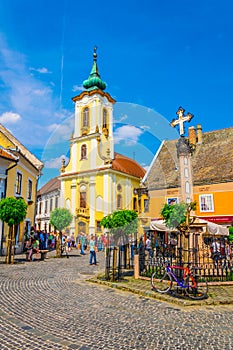 SZENTENDRE, HUNGARY MAY 22, 2016: People are walking in front of the blagovestenska Serbian orthodox church in