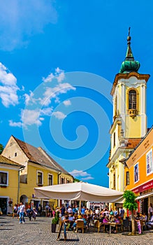 SZENTENDRE, HUNGARY MAY 22, 2016: People are walking in front of the blagovestenska Serbian orthodox church in