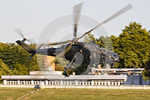 Hungarian Air Force Mil Helicopters Mi-24P Hind 331 military attack helicopter flying over Szolnok city downtown