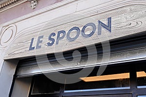 Le Spoon sign text on bar of tv french series movies flagship places of Tomorrow Belongs