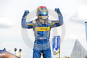 SÃÂ©bastien Buemi exulting on the podium of the E-Prix FIA Formula E