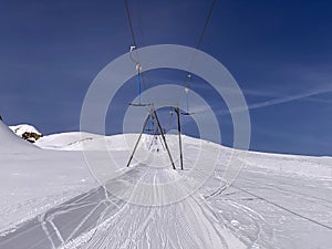 T-bar ski lift Platter - Button lift or TÃ©lÃ©ski Ã  archets Ã  sellettes - Glacier 3000, Les Diablerets - Switzerland