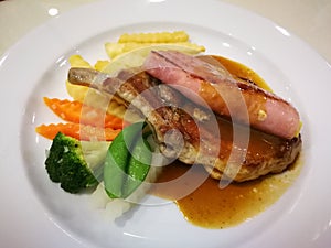 T-bone pepper steak with potatoes fried and vegetables